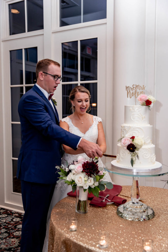 cake cutting during a wedding at deerfield golf club