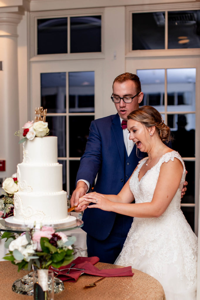 cake cutting during a wedding at deerfield golf club