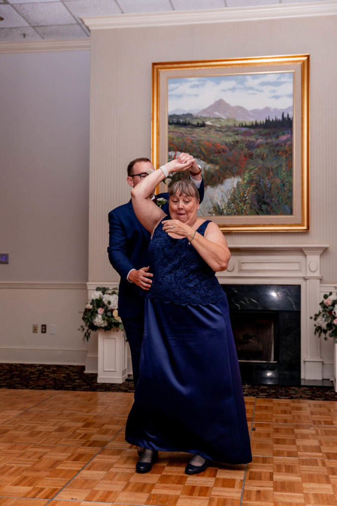 parent dances during a wedding reception at deerfield golf club