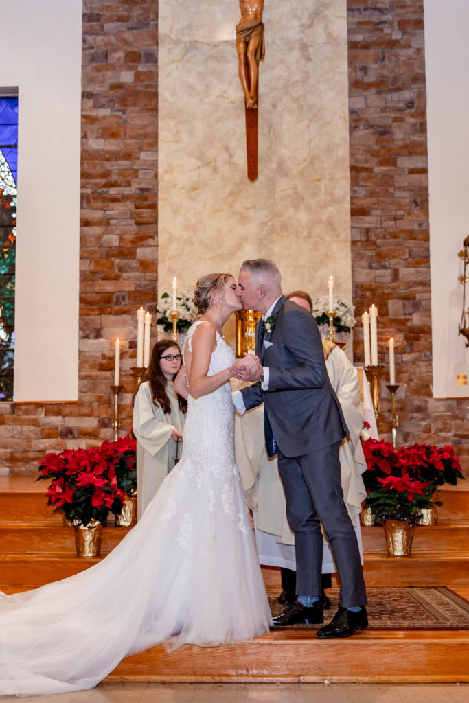 bride and groom kissing during philadelphia wedding ceremony