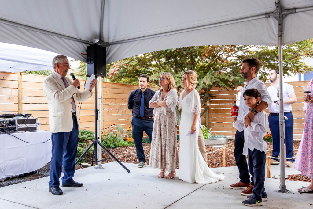 toasts during an intimate backyard wedding cape may new jersey