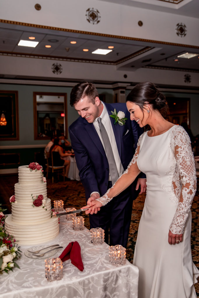 cake cutting during a wedding reception at mendenhall inn
