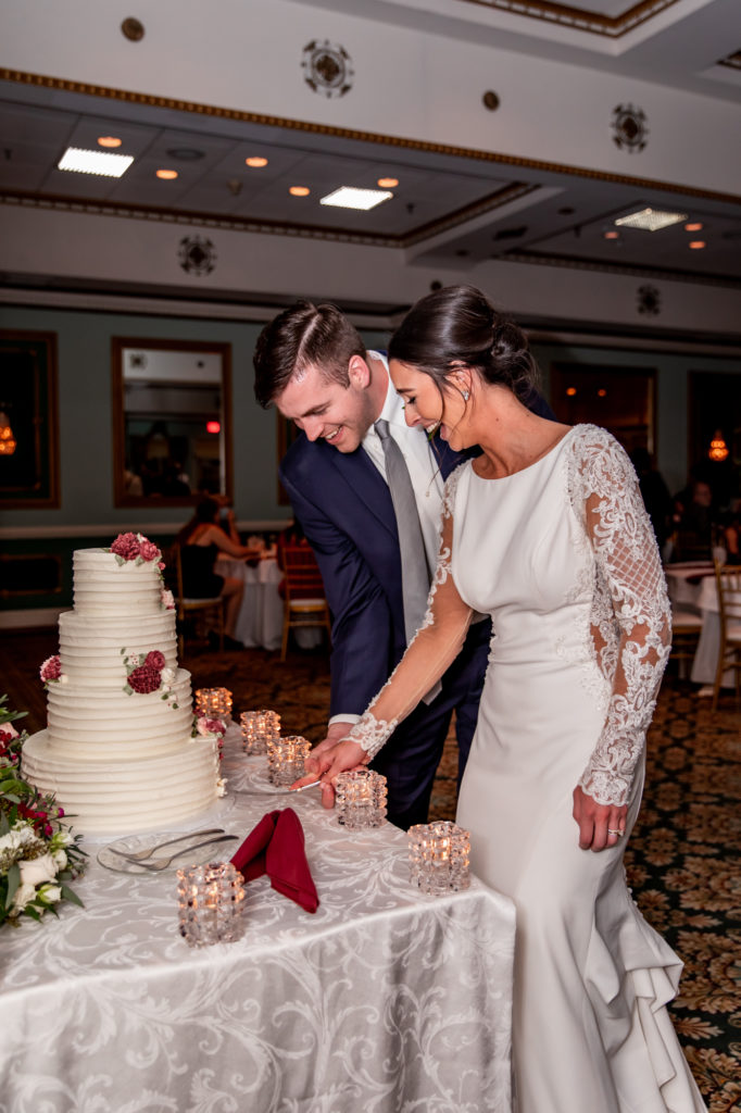 cake cutting during a wedding reception at mendenhall inn