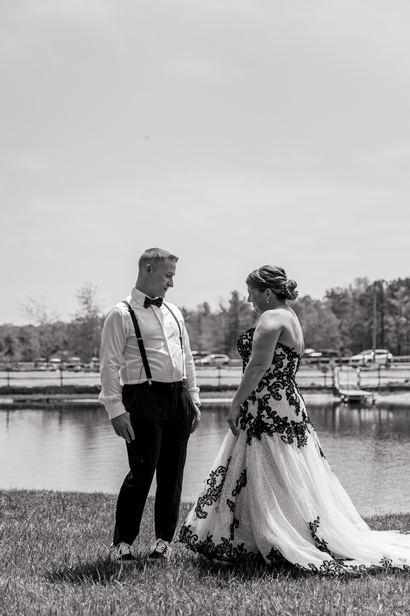 first look on a wedding day by a lake in the poconos