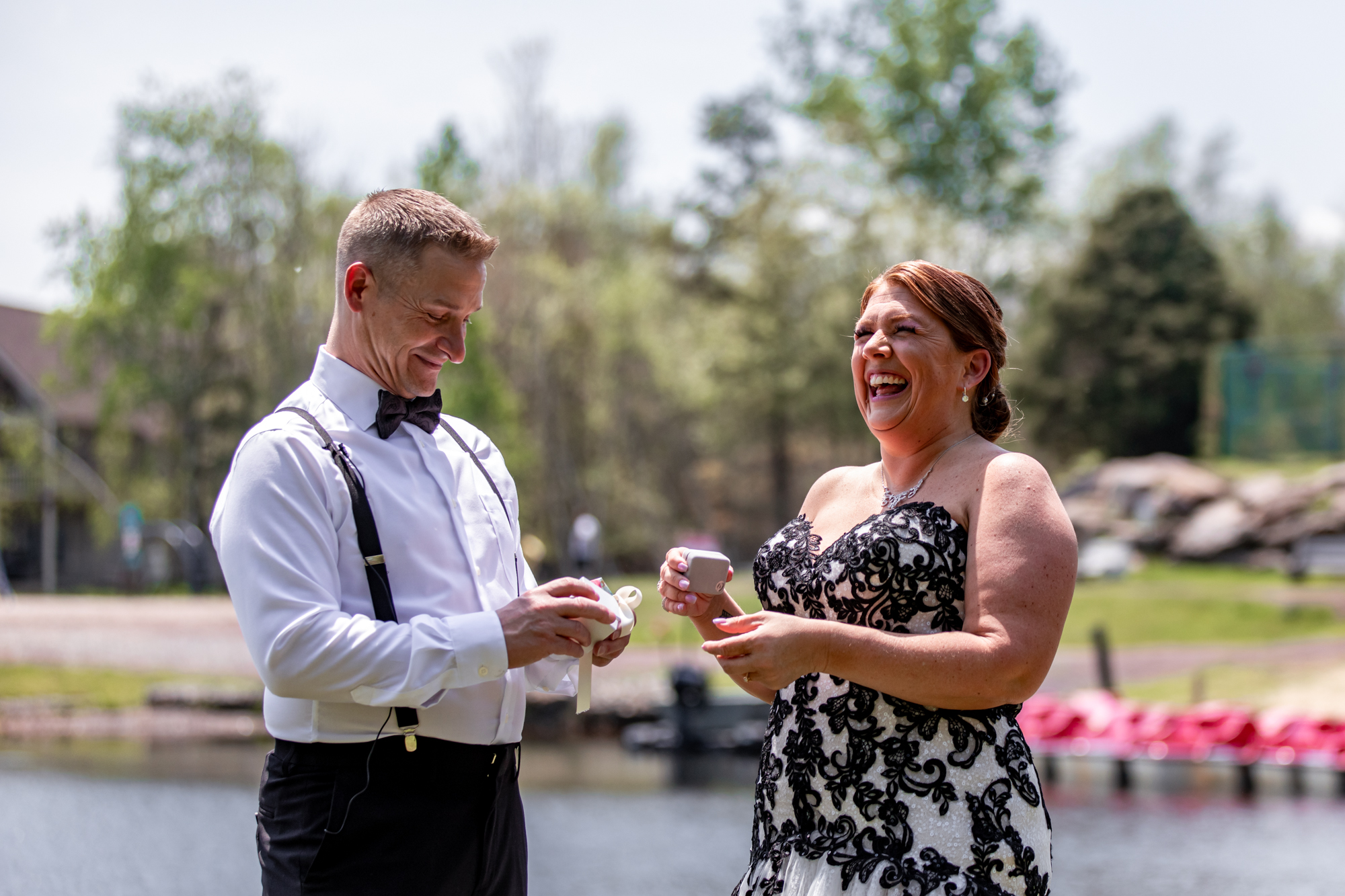 first look on a wedding day by a lake in the poconos