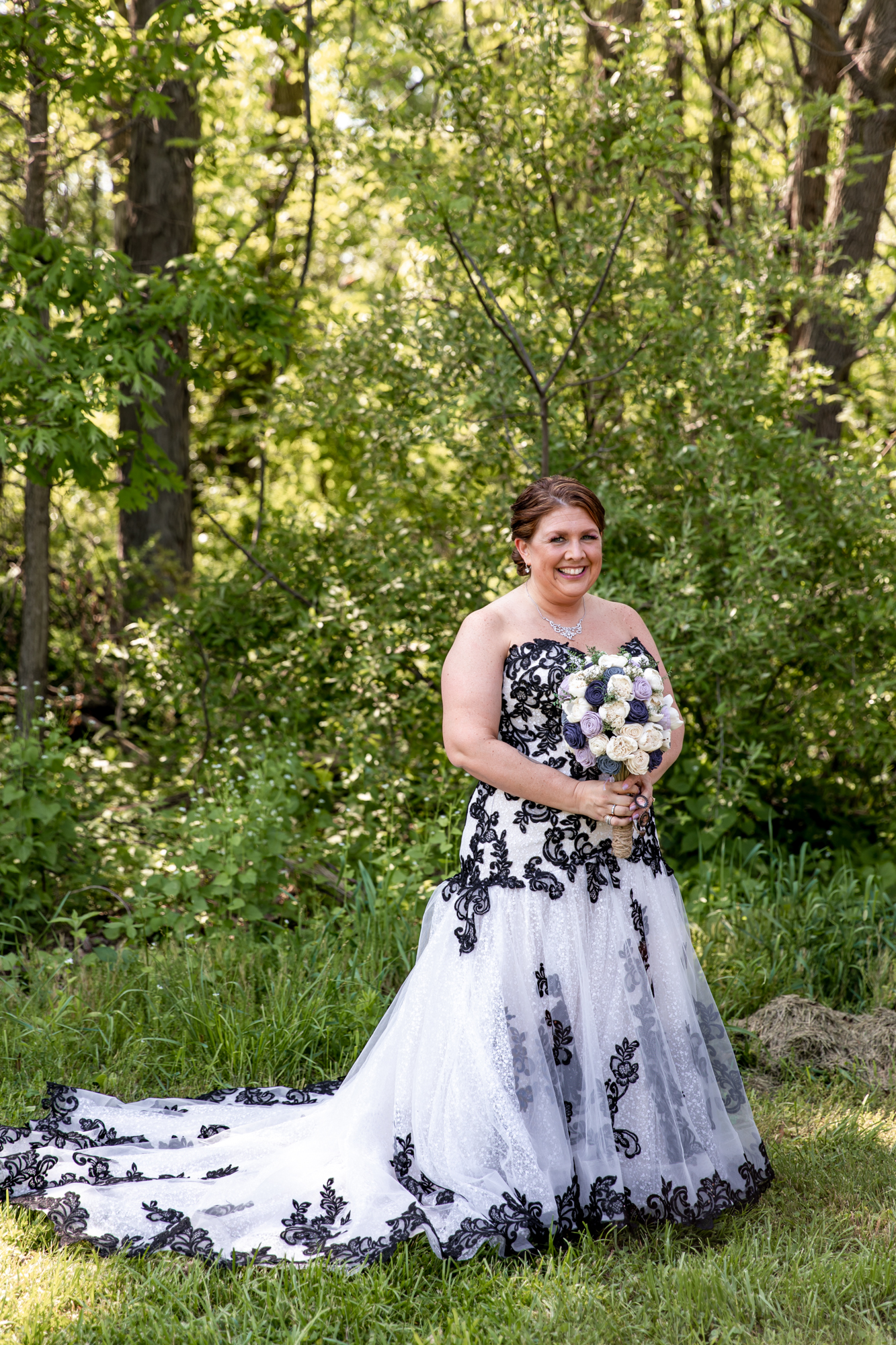 bridal portraits before an outdoor barn wedding