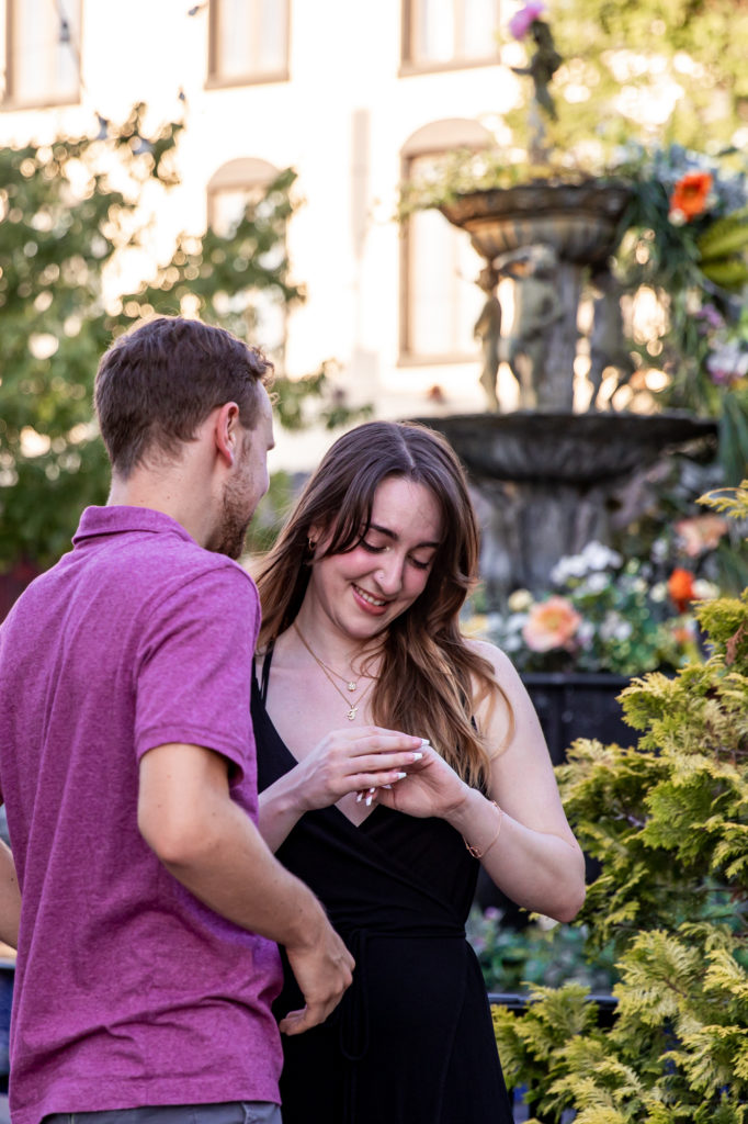 celebrating after a proposal in front of the singing fountain in south philly