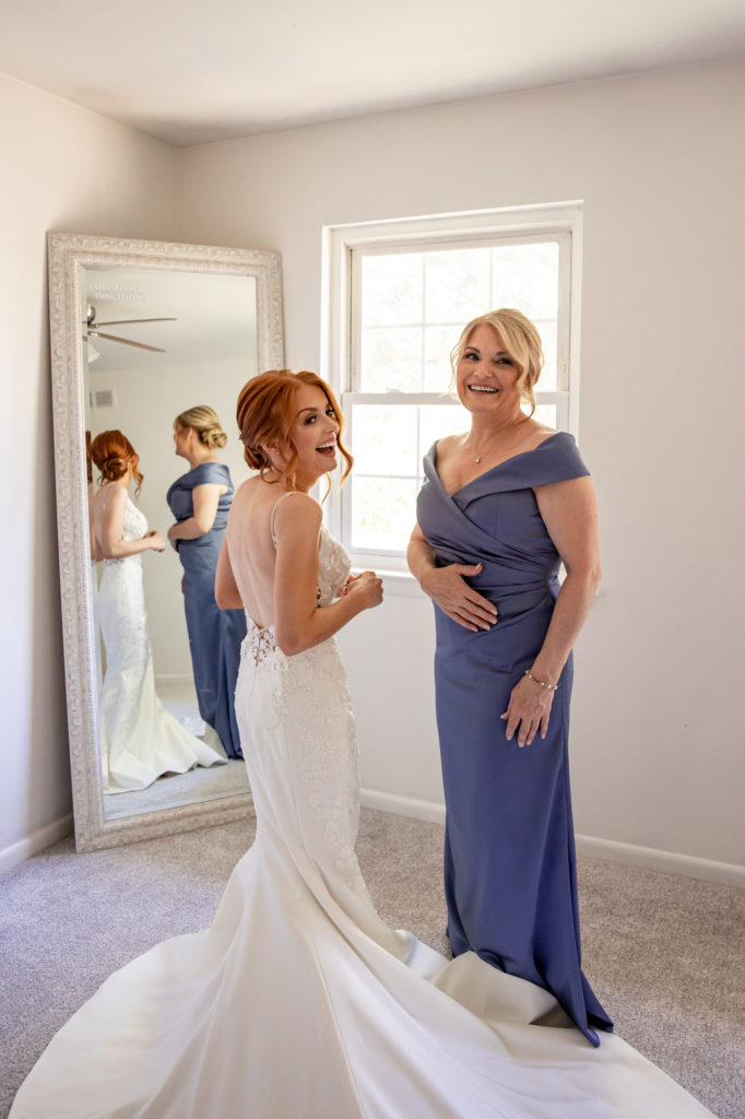 mother of the bride laughing with bride