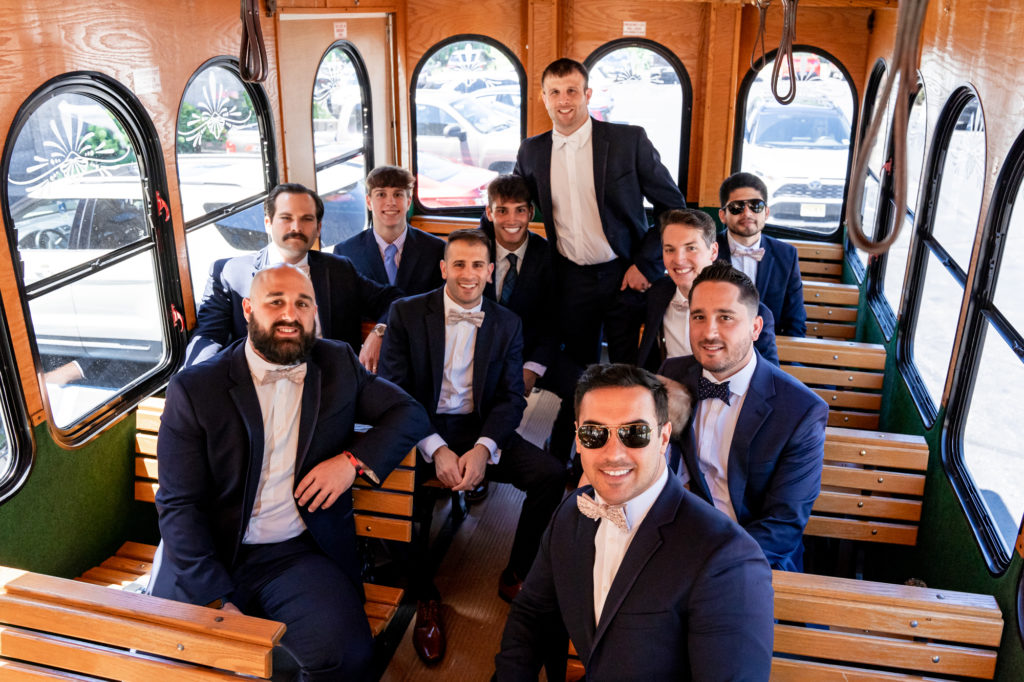 groomsmen on wedding trolley