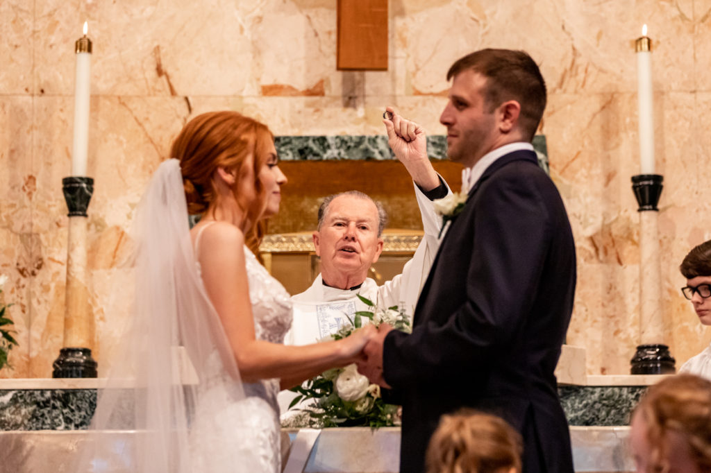 bride and groom during Catholic wedding ceremony