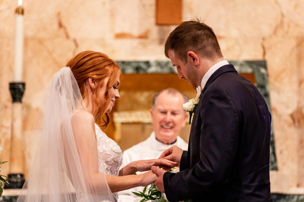 bride and groom during Catholic wedding ceremony