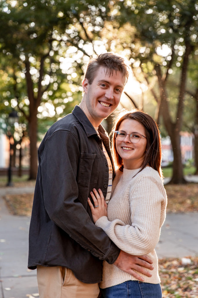 a couples poses for photos at washington square park in old city philadelphia