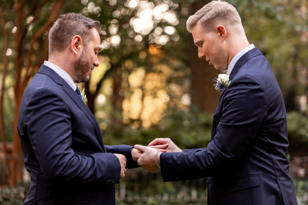 exchanging the rings during a self-uniting wedding ceremony in rittenhouse square, philadelphia