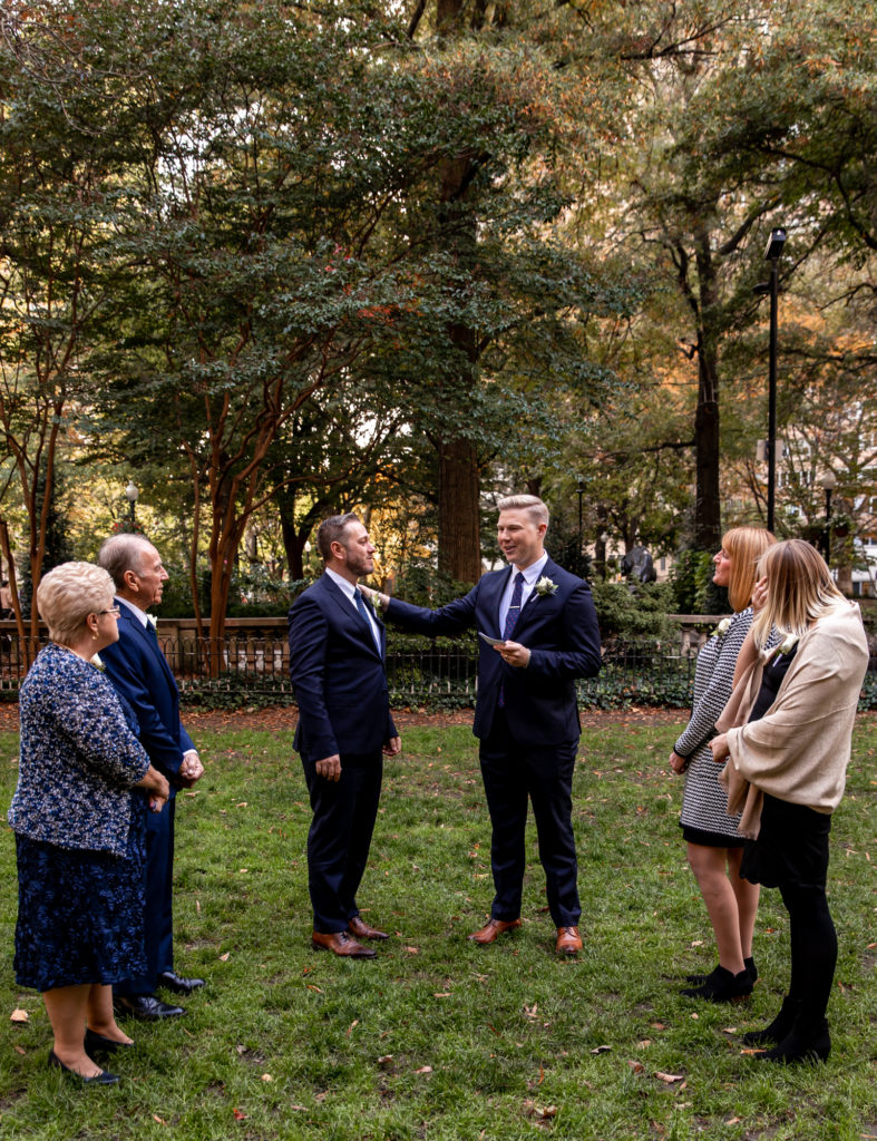 exchanging the rings during a self-uniting wedding ceremony in rittenhouse square, philadelphia