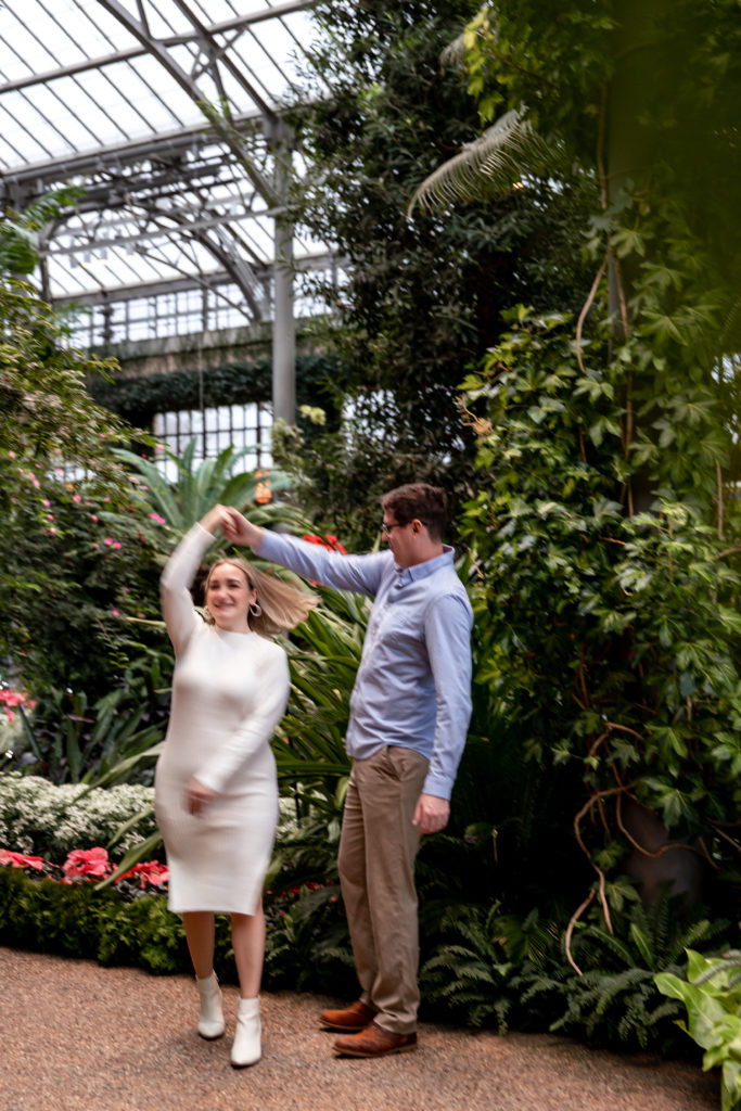 engagement photos at longwood gardens during christmastime