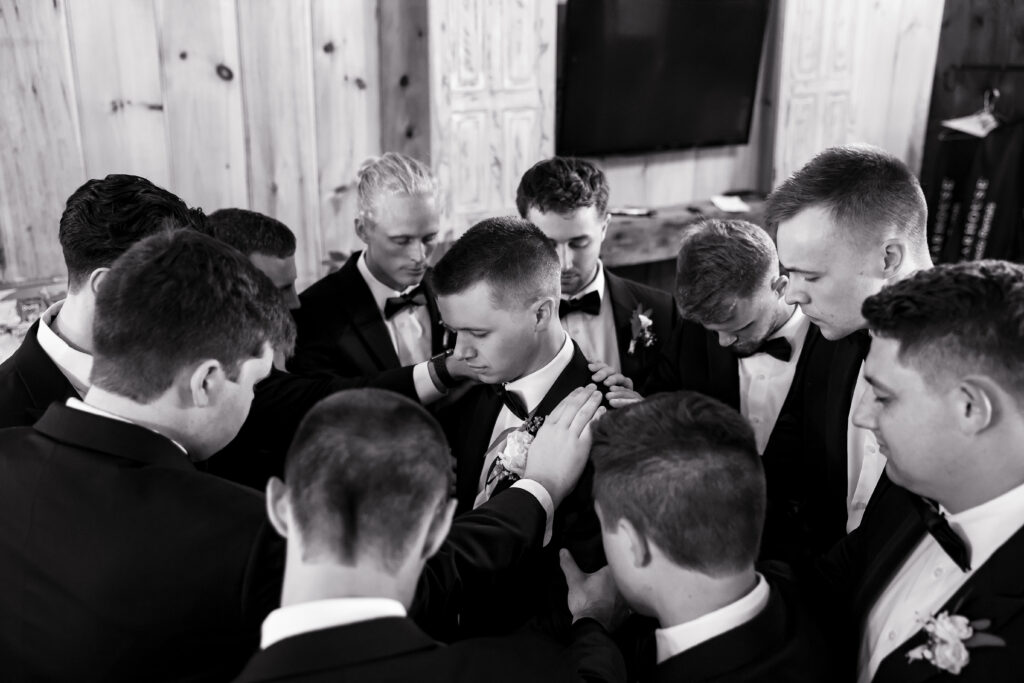 groomsmen prayer before ceremony