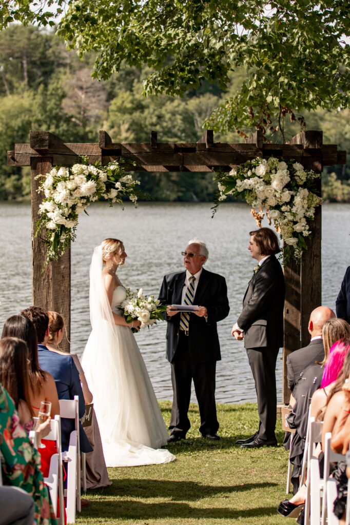 outdoor wedding ceremony at trout lake in the poconos