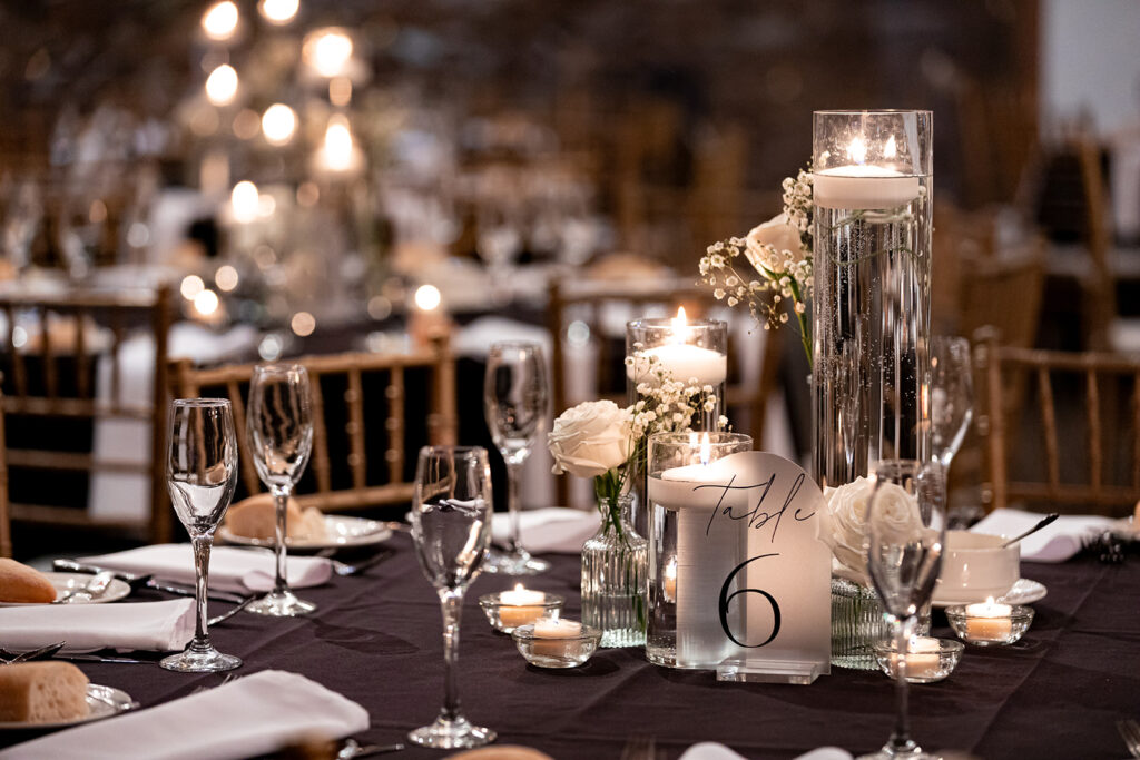 simple black and white reception table decor with baby's breath flower at la massaria at bella vista