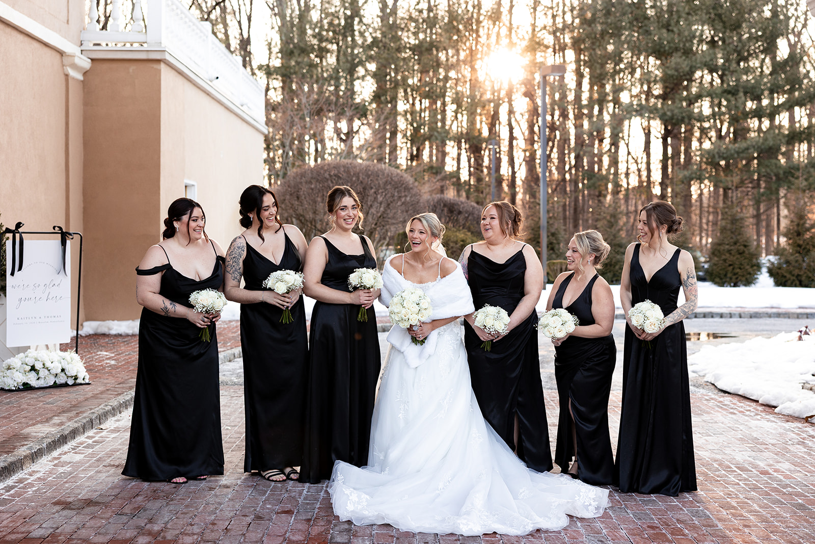 a bride and her bridesmaids laugh as they take photos during a wedding at Pen Ryn Estate Belle Voire.